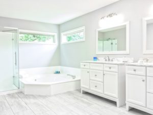 bathroom with tub and vanity