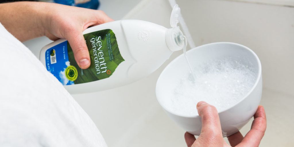 pouring dish soap into bowl